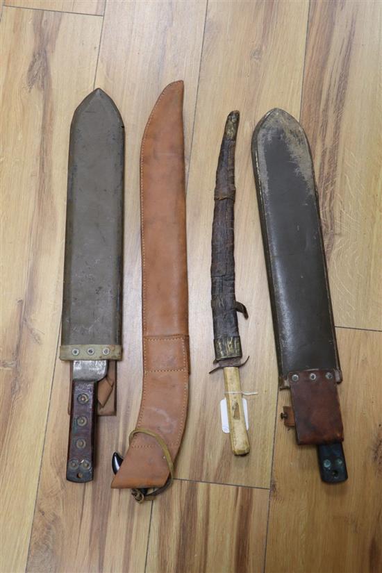 An Islamic tusk handled dagger and three 20th century machetes, longest 60cm